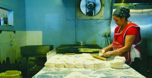 Making fresh tortillas at Las Quatro Milpas
